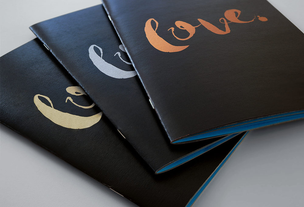 Gold, silver, copper and black notebooks