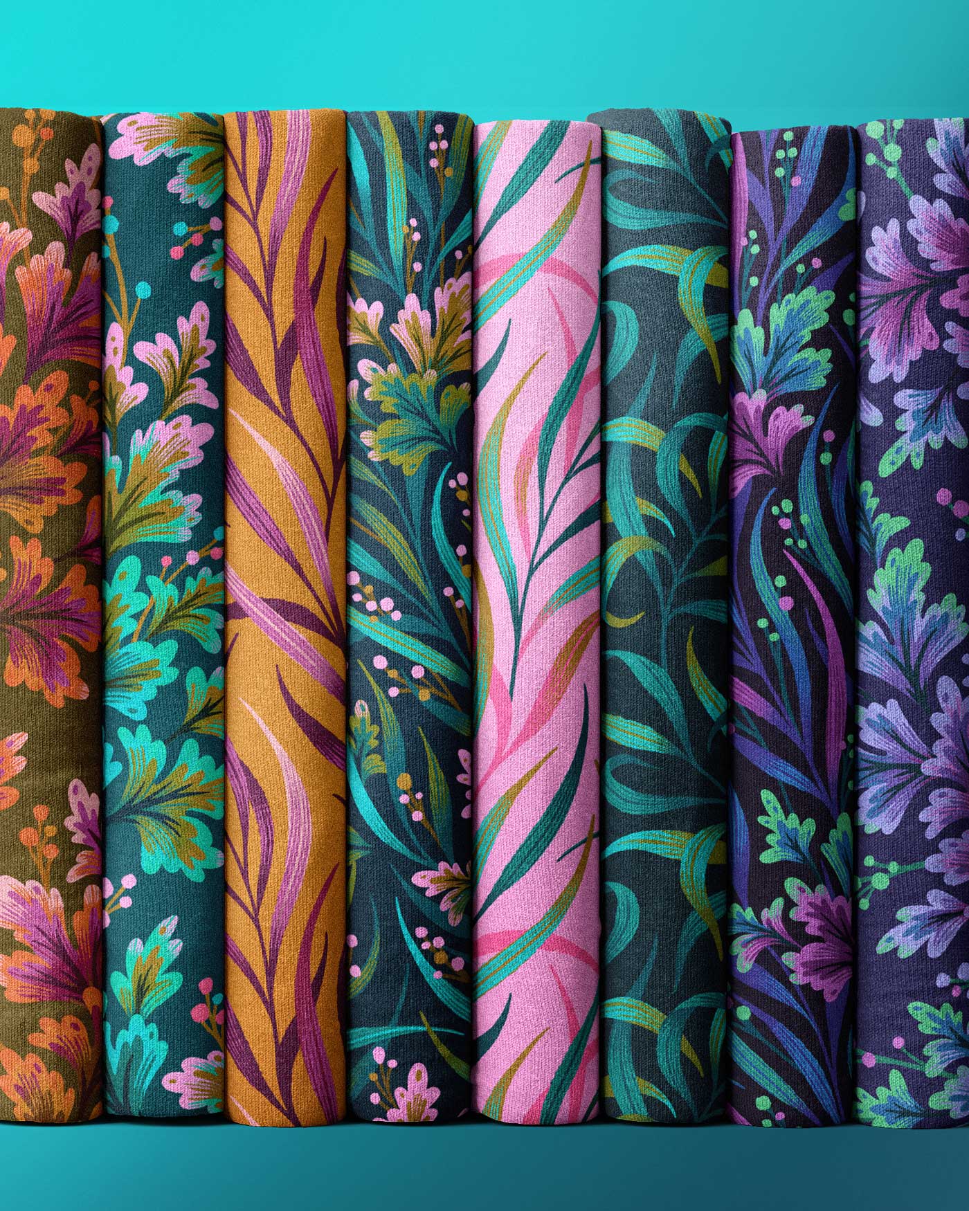 Fabric rolls collection of foliage patterns in green, pink and purple by Andrea Muller