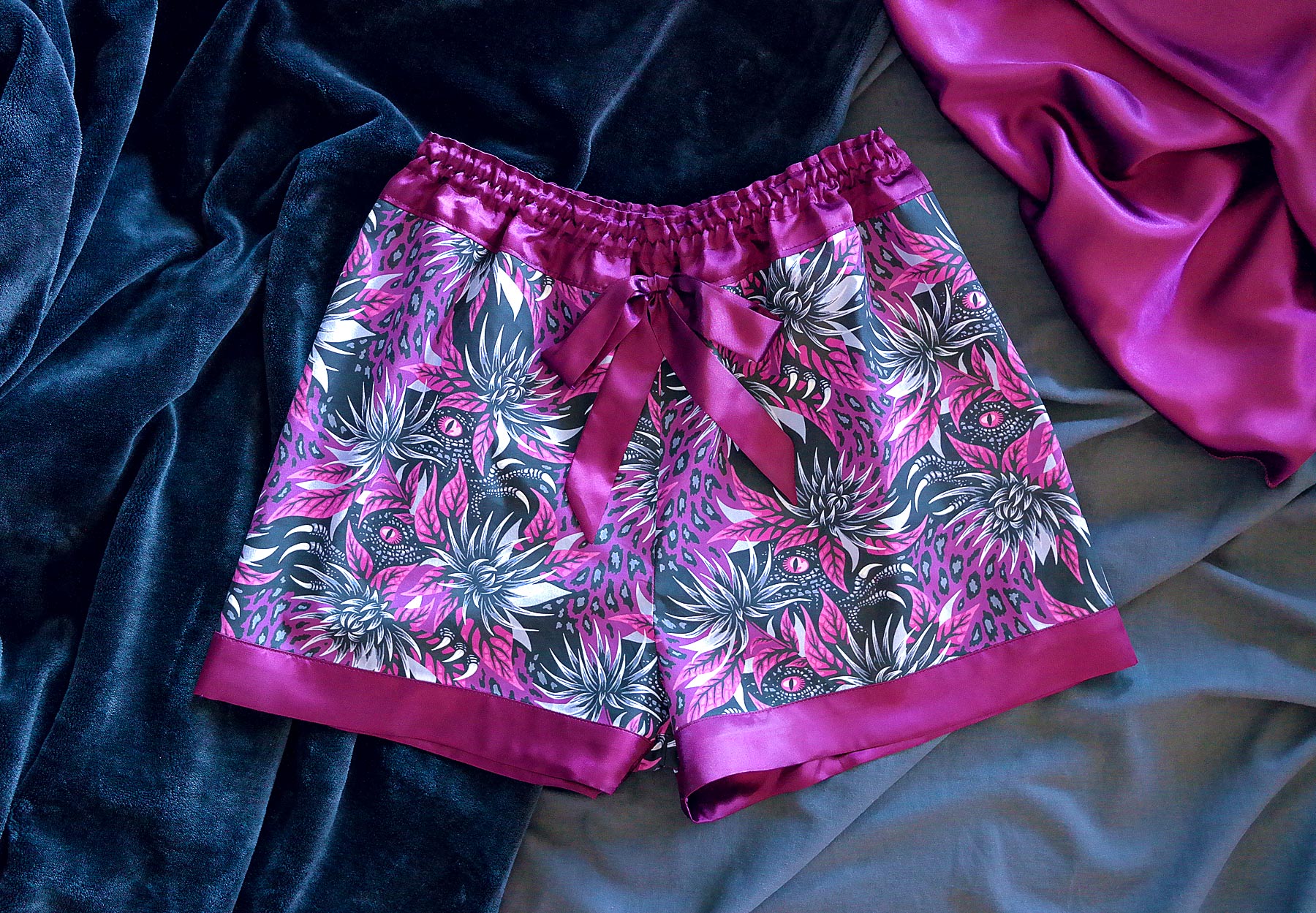 Pyjama shorts with dinosaurs and flowers purple by Andrea Muller