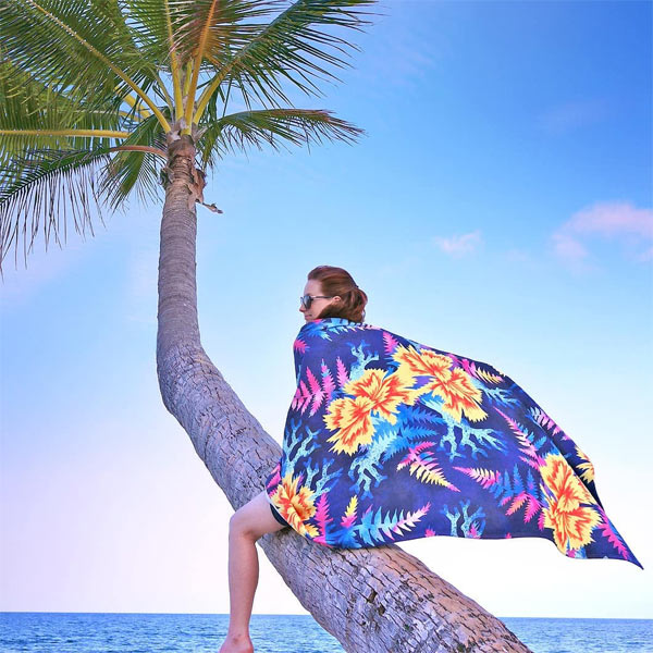 Coral and flowers beach towel by Andrea Muller