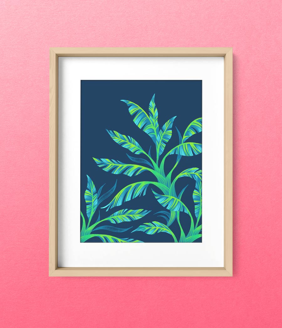 Framed print of green tropical banana leaf illustration on pink wall by Andrea Muller