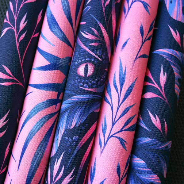 Navy and coral pink tropical fabric collection with velociraptors by Andrea Muller