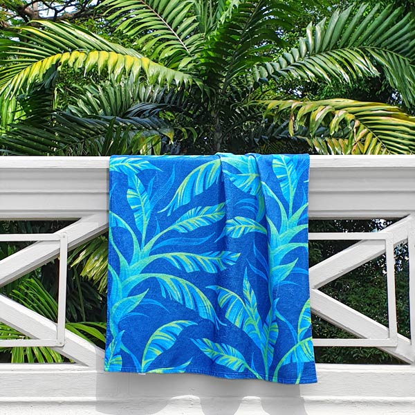 Tropical green banana leaf patterned beach towel by Andrea Muller