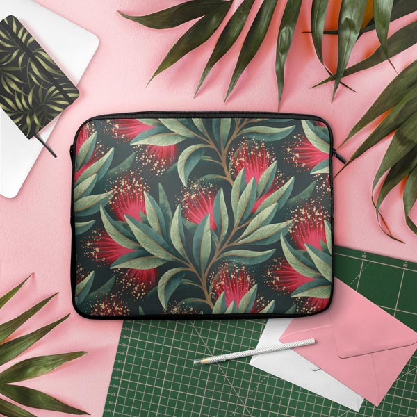 Red and green Pohutukawa floral pattern laptop sleeve by Andrea Muller