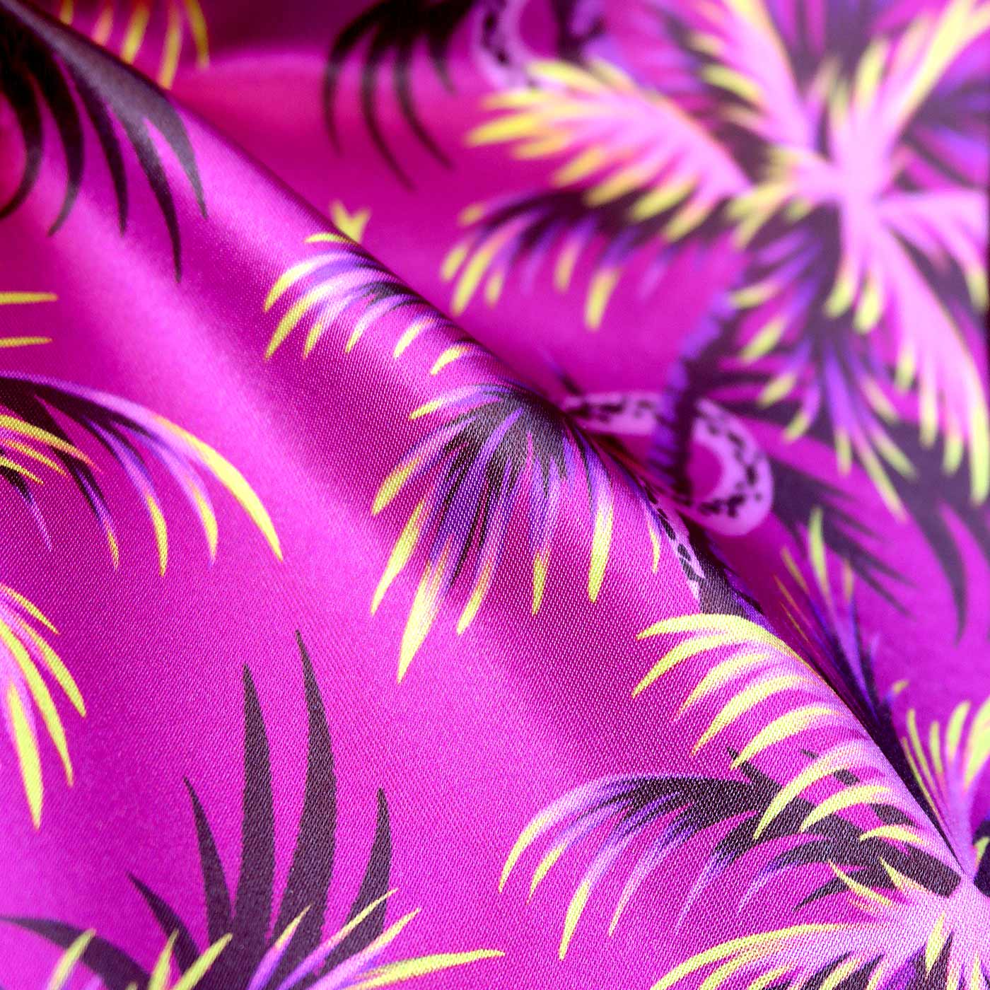 Snakes and palm trees pattern pink fabric by Andrea Muller
