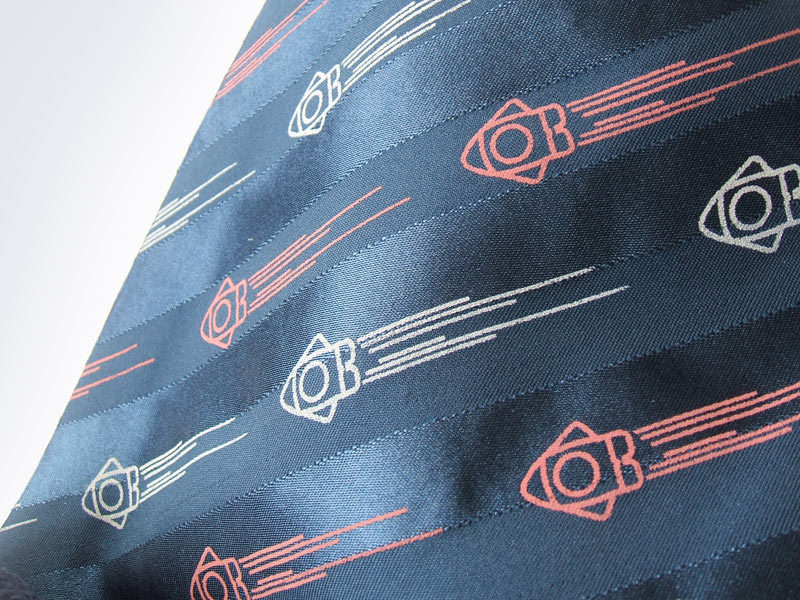 Navy satin striped fabric with rocket screenprint