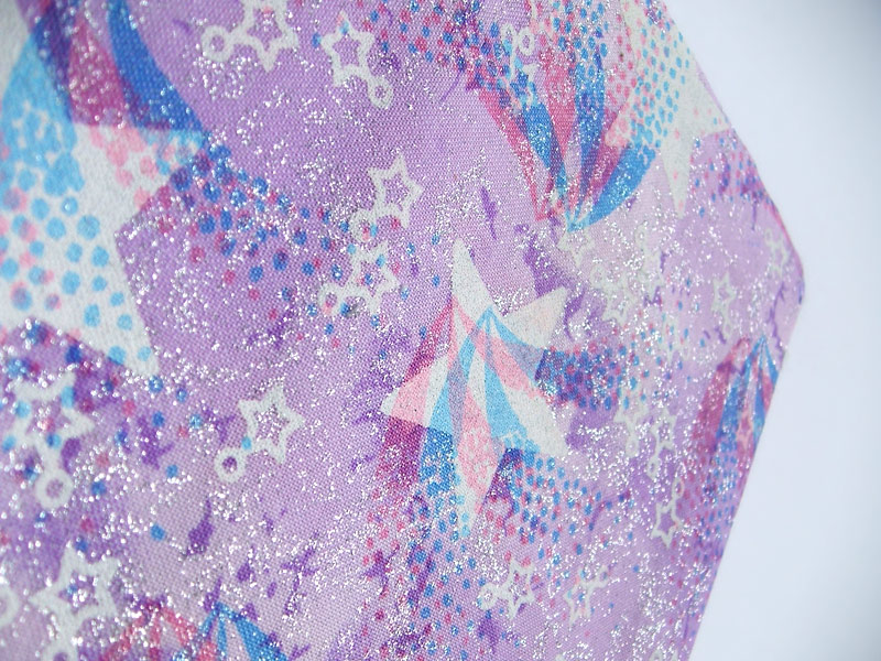 Purple cotton fabric with star print and silver sparkle