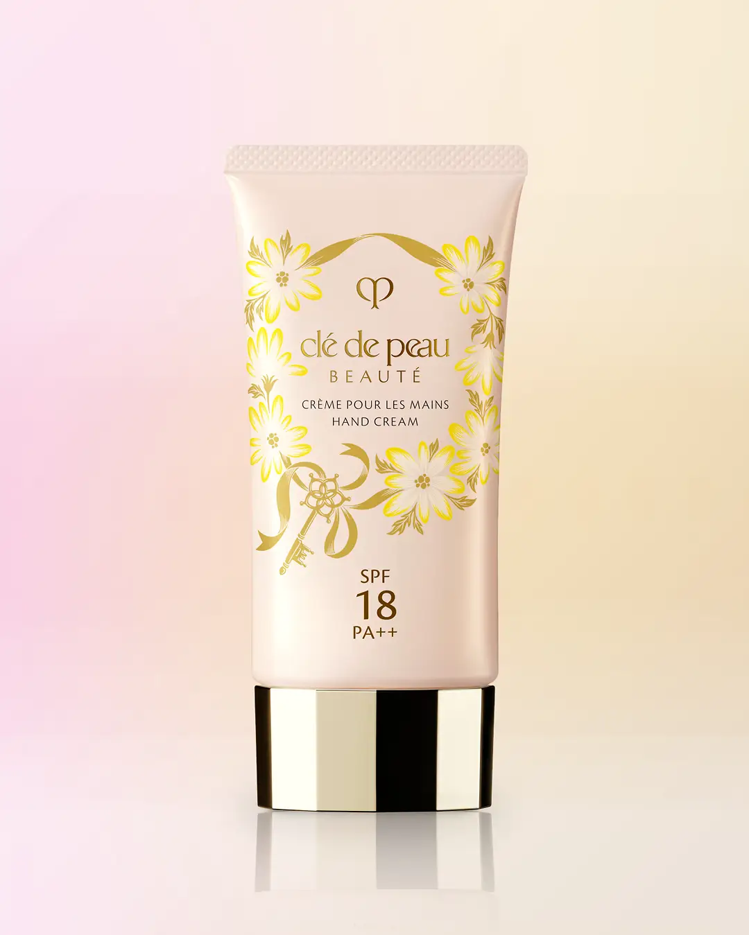 Clé de Peau Beauté Hand Cream bottle design with yellow daisy wreath by Andrea Muller