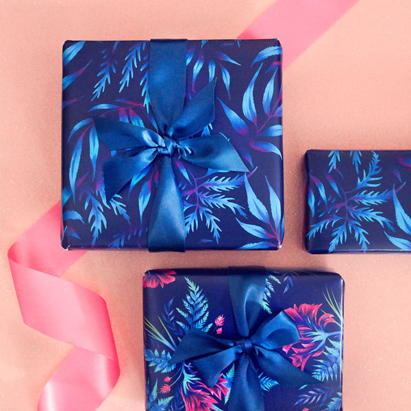Blue tropical leaf patterned wrapping paper by Andrea Muller