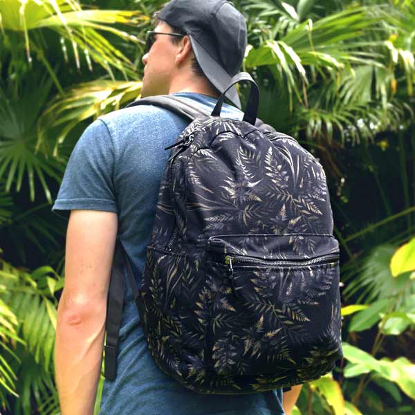 Black backpack with watercolor fern leaf pattern by Andrea Muller