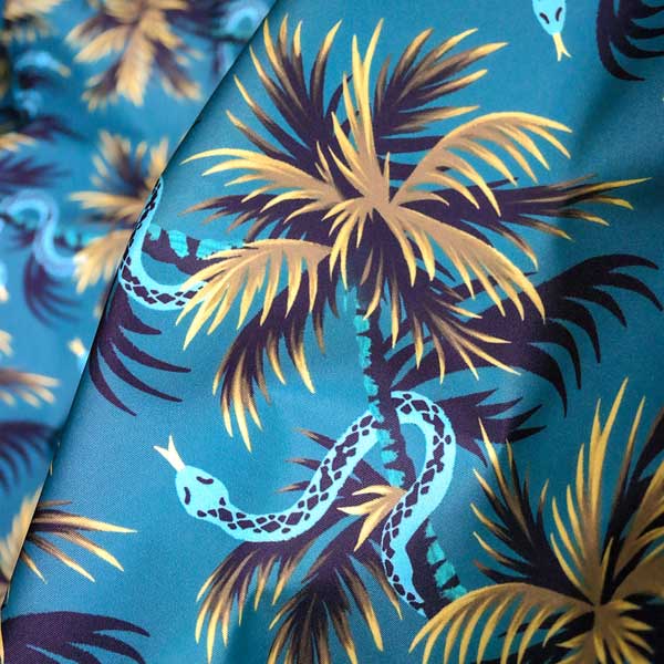 Tropical snakes and palm trees fabric pattern by Andrea Muller